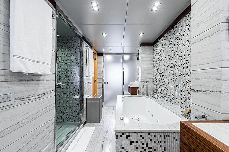 a bathroom with a large bathtub aboard BOMBAY Yacht for Sale