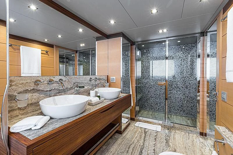 a bathroom with a large mirror aboard BOMBAY Yacht for Sale