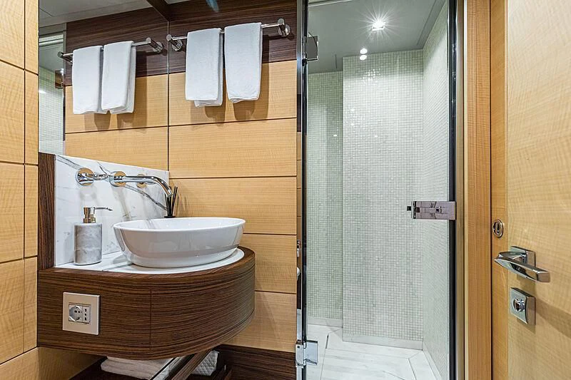 a bathroom with a sink and shower aboard BOMBAY Yacht for Sale