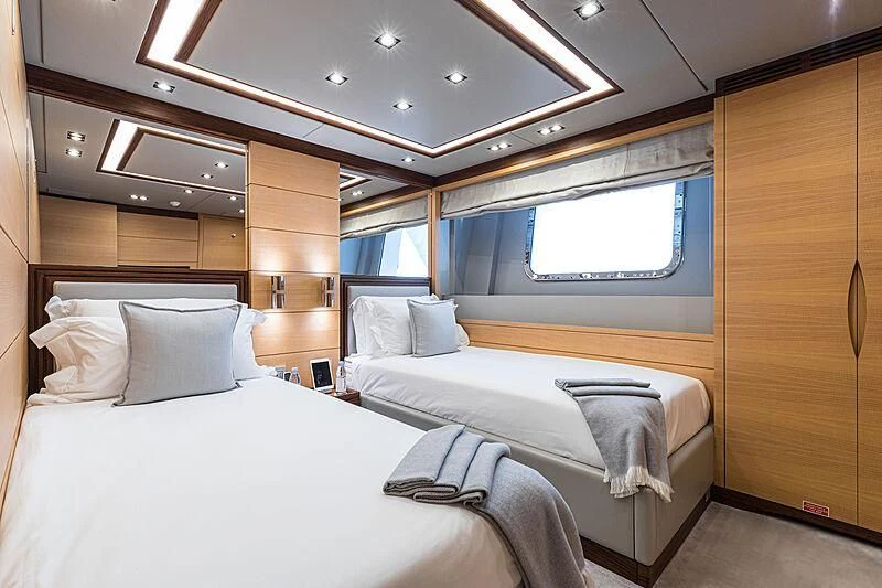 a room with two beds aboard BOMBAY Yacht for Sale