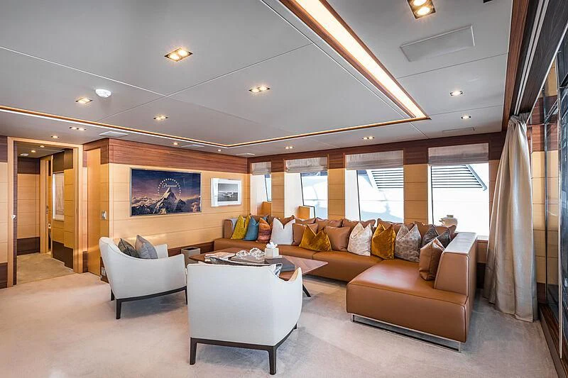 a living room with a couch and a table aboard BOMBAY Yacht for Sale