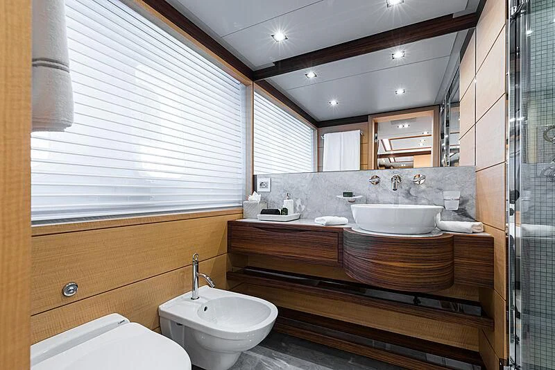 a bathroom with a large mirror aboard BOMBAY Yacht for Sale