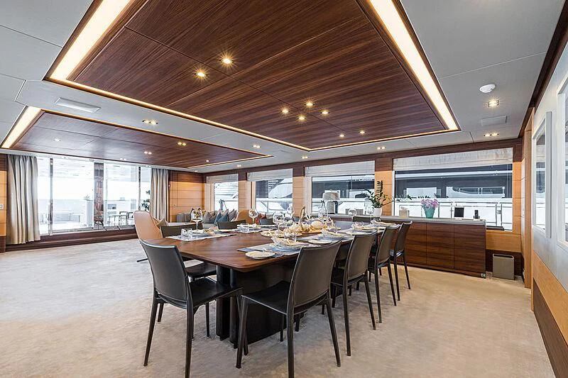 a large kitchen and dining area aboard BOMBAY Yacht for Sale