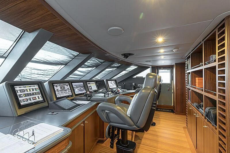 a room with computers and monitors aboard BOMBAY Yacht for Sale