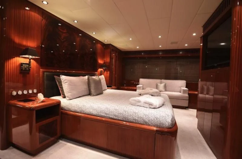 a bed in a room aboard DARK KNIGHT Yacht for Sale