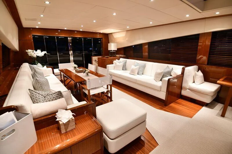 a room with a bed and a couch aboard DARK KNIGHT Yacht for Sale