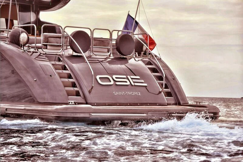 a boat with flags on it aboard DARK KNIGHT Yacht for Sale