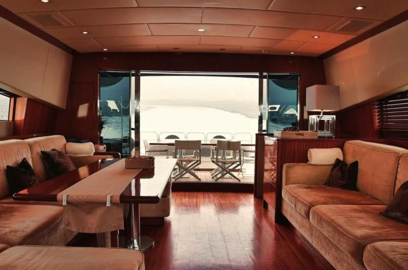 a living room with a large window aboard DARK KNIGHT Yacht for Sale
