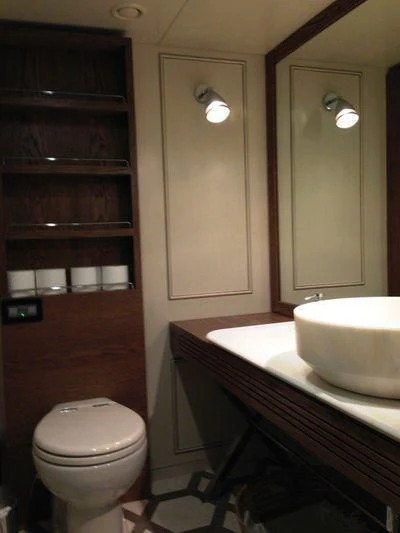 a bathroom with a sink and toilet aboard LUTTEUR Yacht for Sale