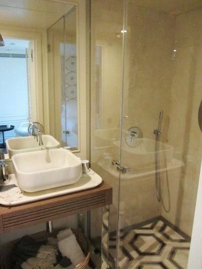 a bathroom with a sink and a shower aboard LUTTEUR Yacht for Sale