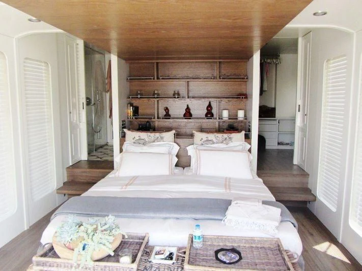 a large bedroom with a large bed aboard LUTTEUR Yacht for Sale