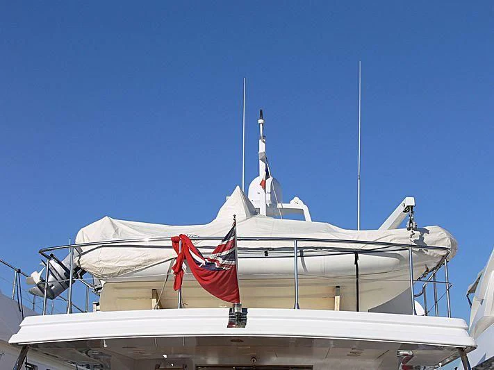 a large boat with a flag on it aboard RIMA Yacht for Sale