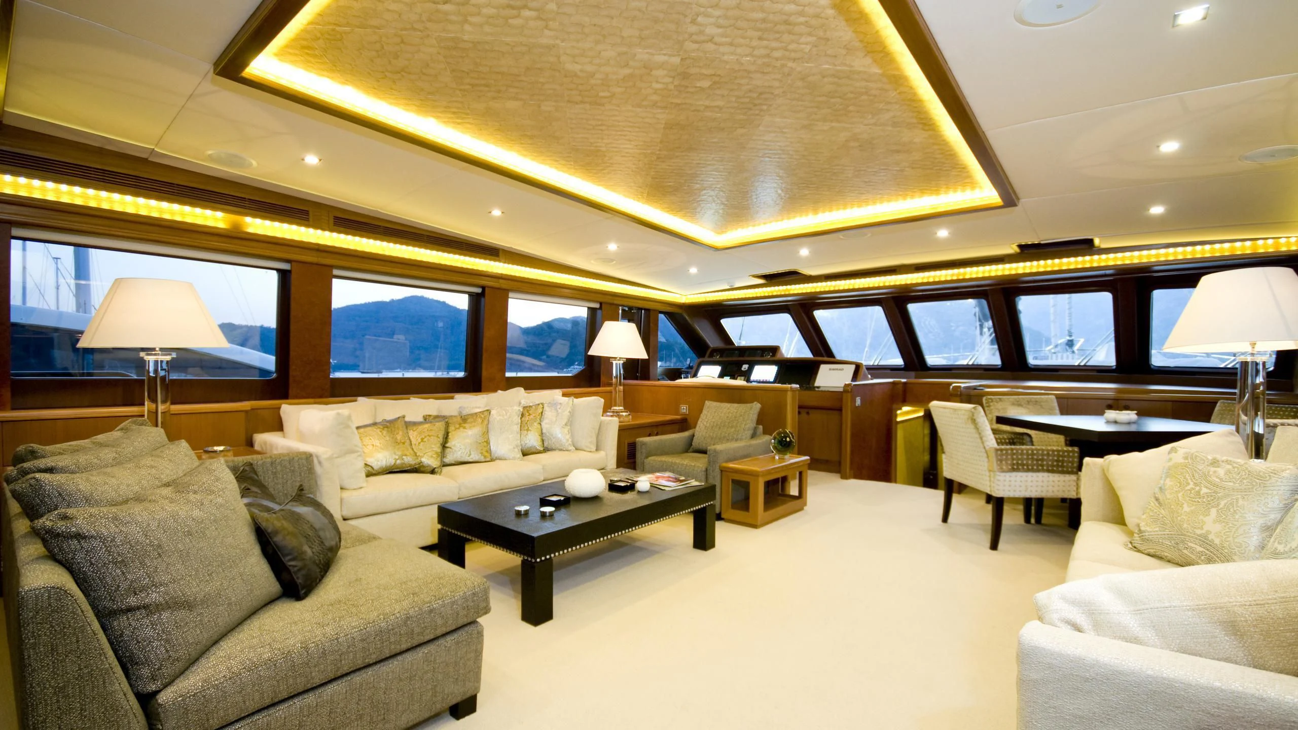 a living room with a large window aboard DAIMA Yacht for Sale