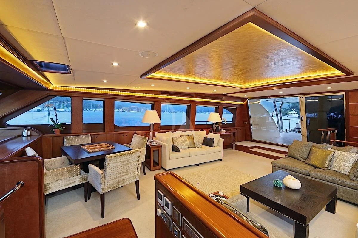 a living room with a large window aboard DAIMA Yacht for Sale