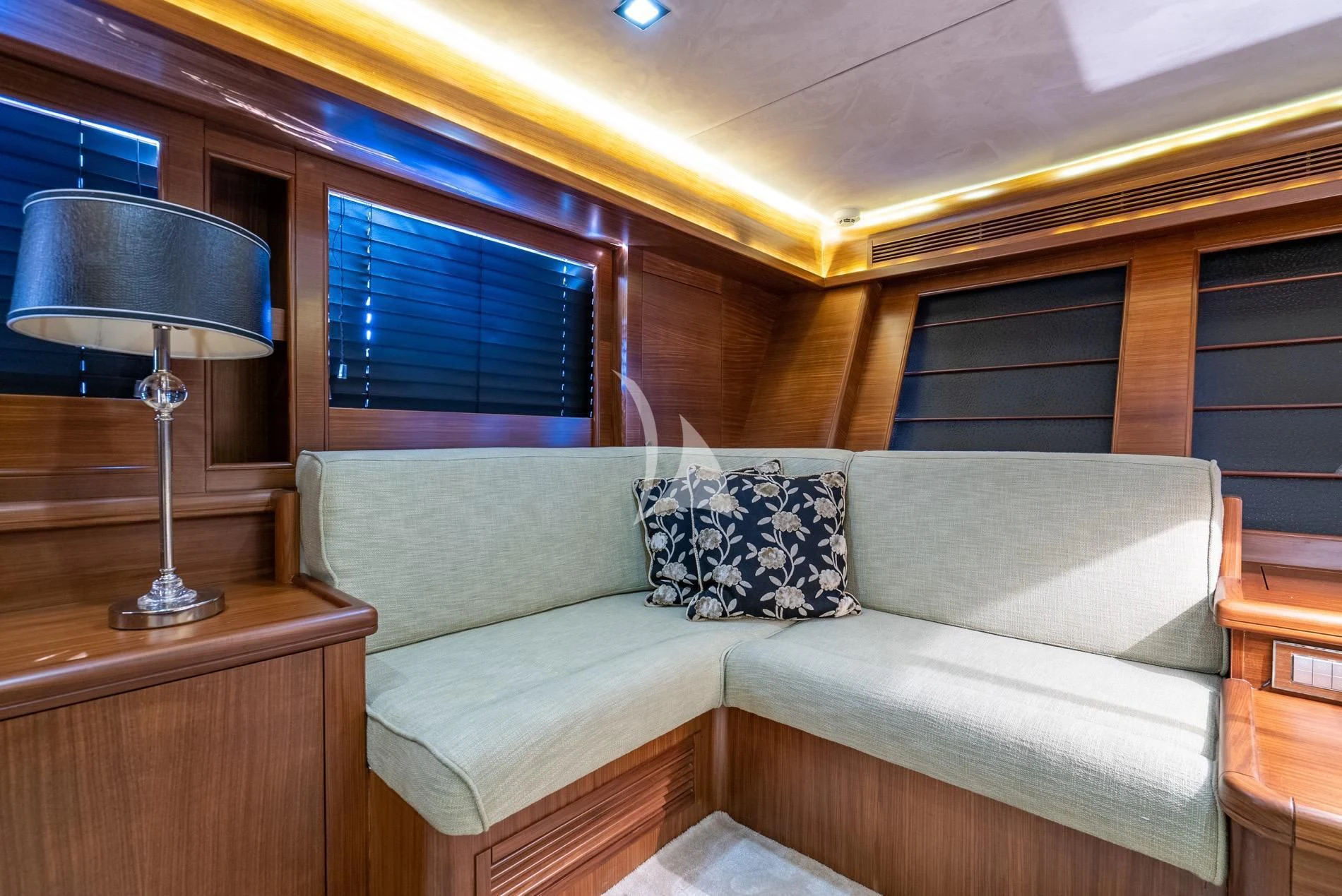a couch in a room aboard DAIMA Yacht for Sale