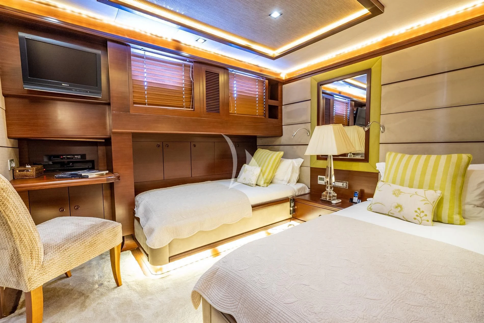 a room with two beds aboard DAIMA Yacht for Sale