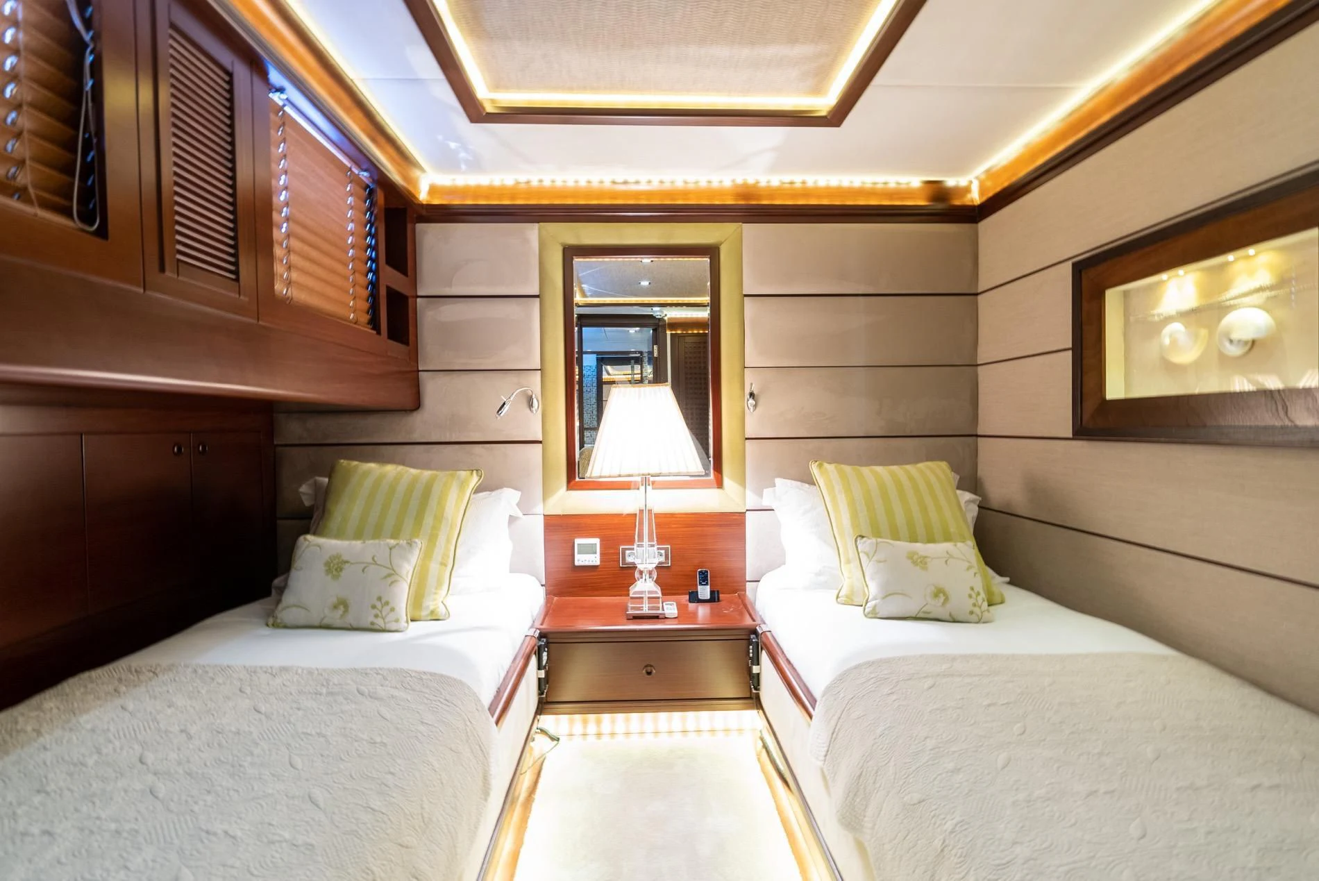 a room with two beds aboard DAIMA Yacht for Sale