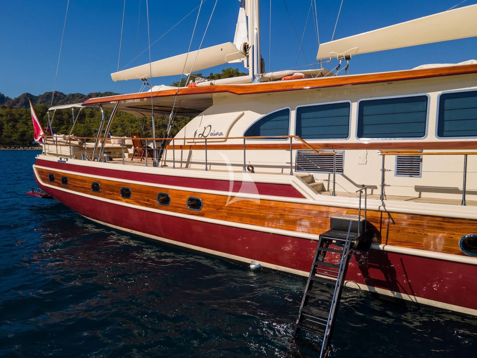 a boat docked at a pier aboard DAIMA Yacht for Sale