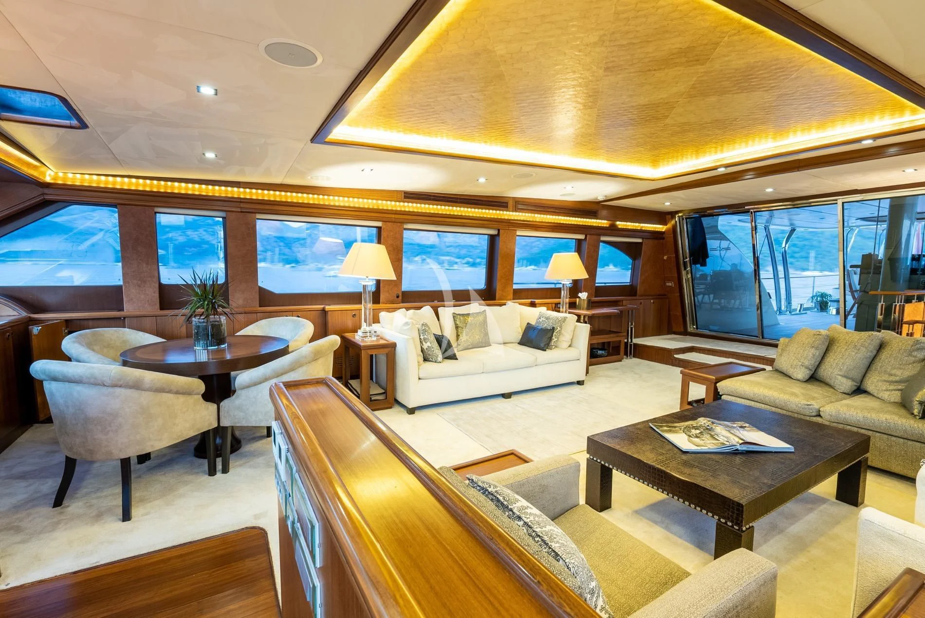 a living room with a large window aboard DAIMA Yacht for Sale