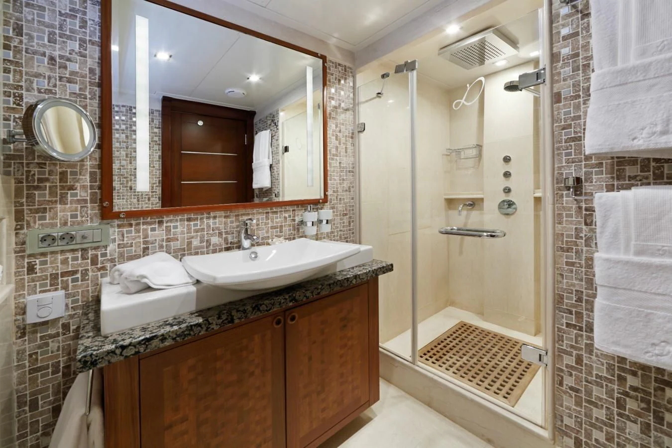 a bathroom with a sink and a mirror aboard DAIMA Yacht for Sale
