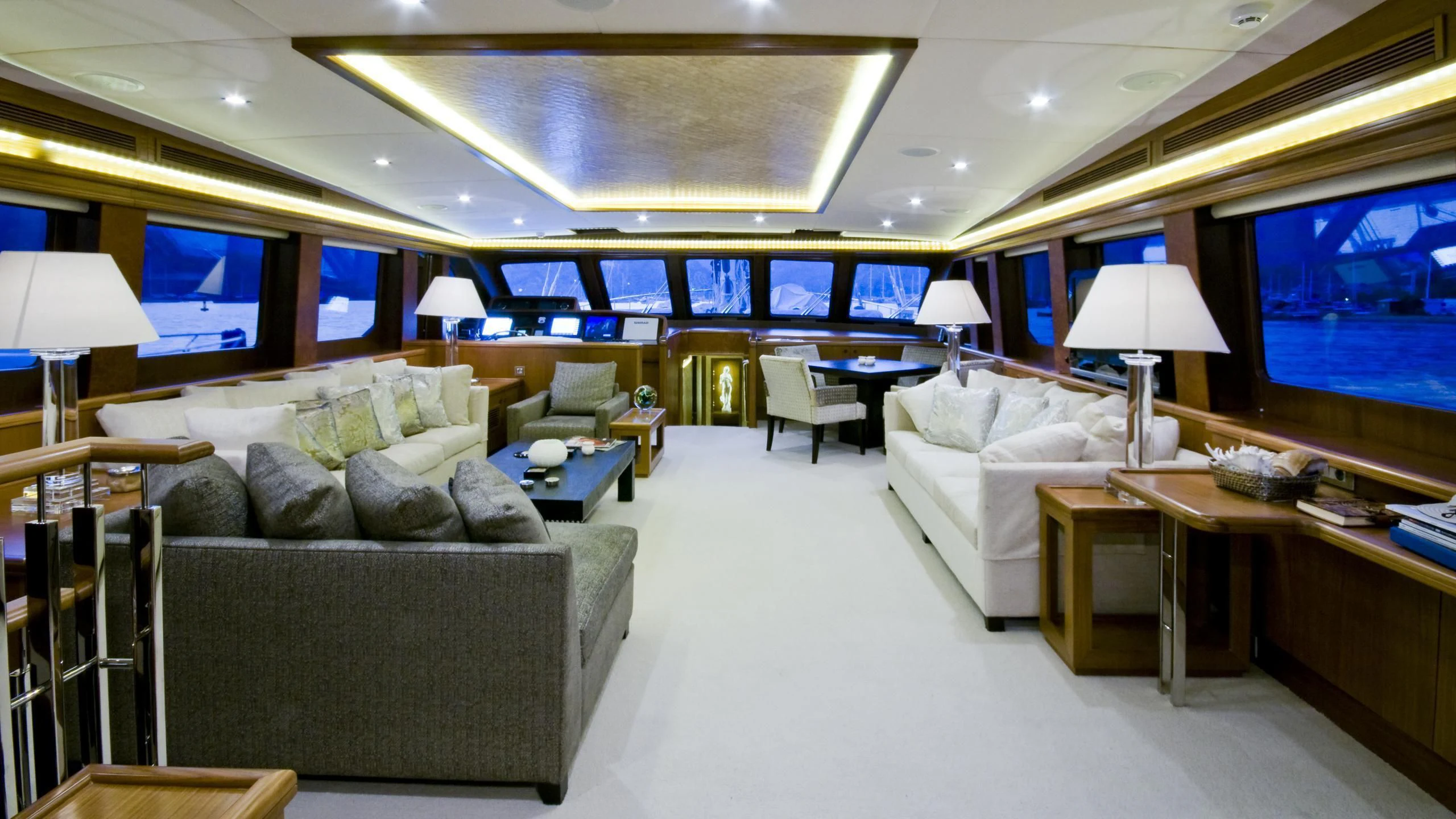a large living room with a large screen aboard DAIMA Yacht for Sale