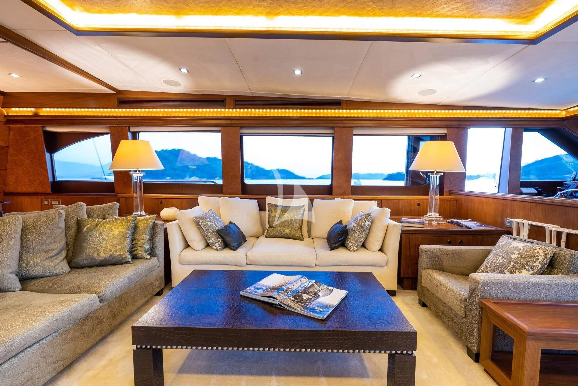 a living room with a large window aboard DAIMA Yacht for Sale