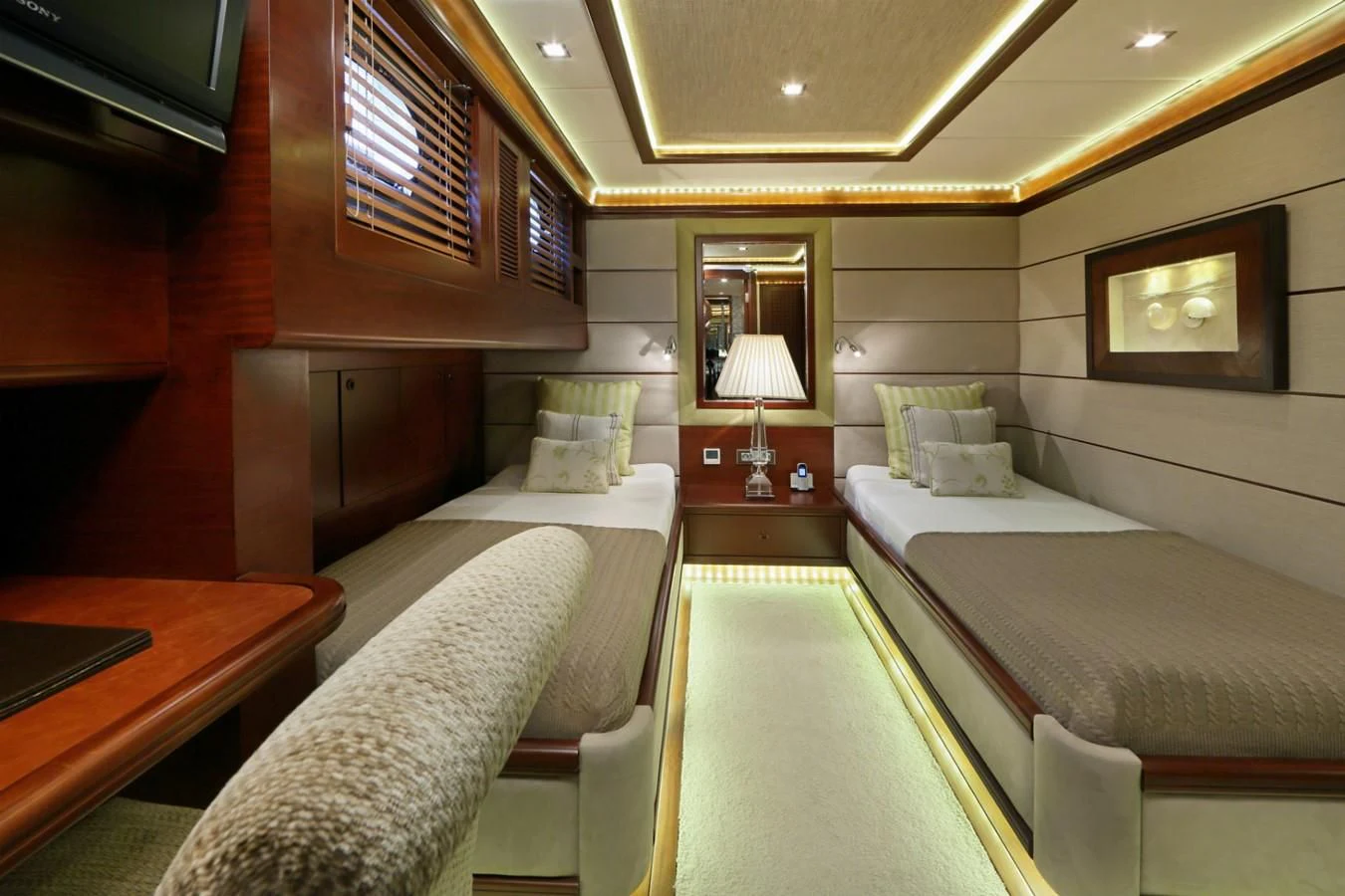a room with two beds aboard DAIMA Yacht for Sale
