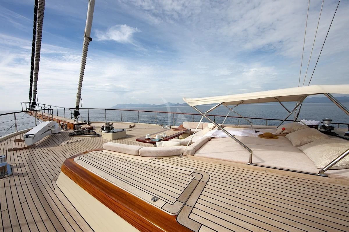 a deck with a view of the ocean and a large bridge aboard DAIMA Yacht for Sale