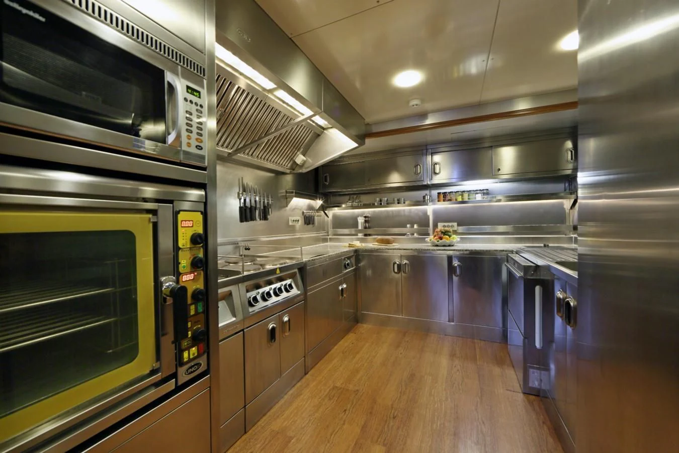 a kitchen with stainless steel appliances aboard DAIMA Yacht for Sale