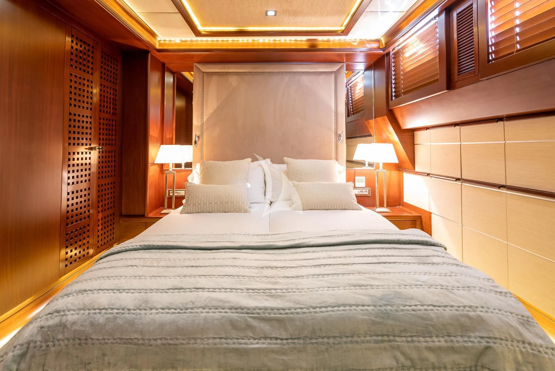 a bed with a large bed aboard DAIMA Yacht for Sale