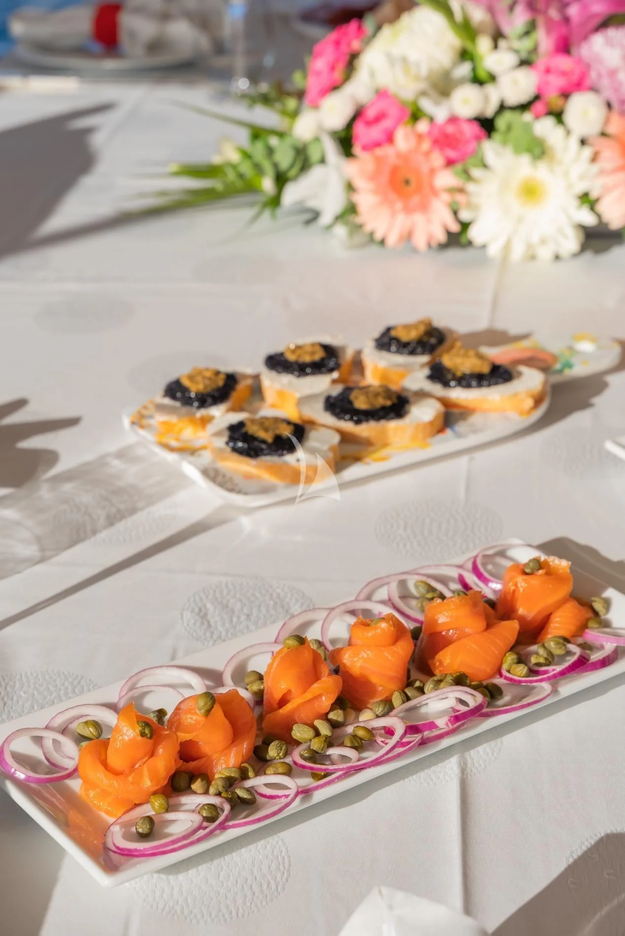 a table with food on it aboard DAIMA Yacht for Sale