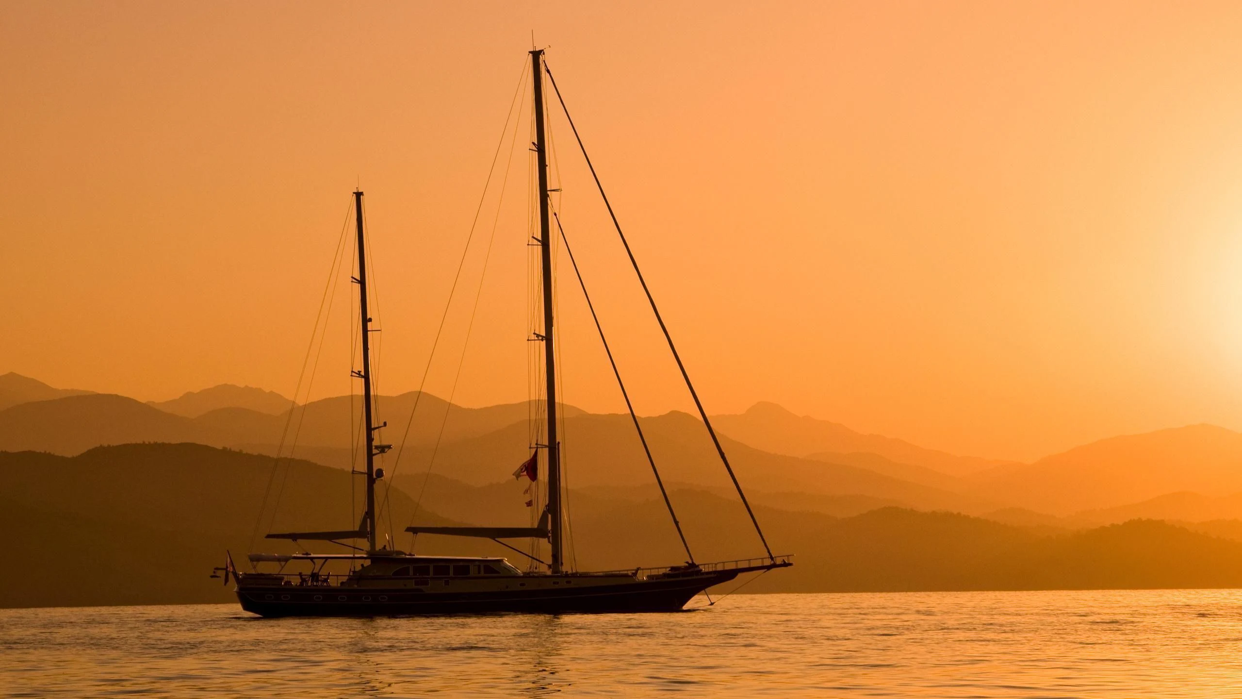 a sailboat in the water aboard DAIMA Yacht for Sale