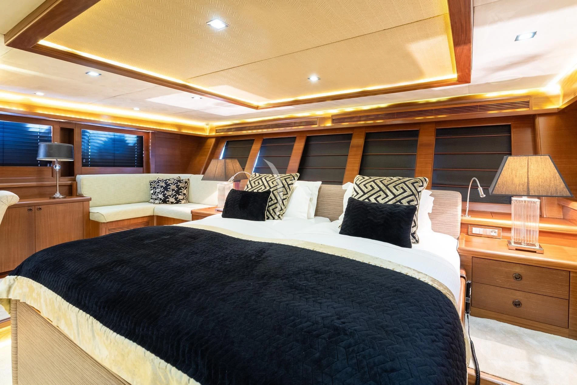 a large bed in a room aboard DAIMA Yacht for Sale