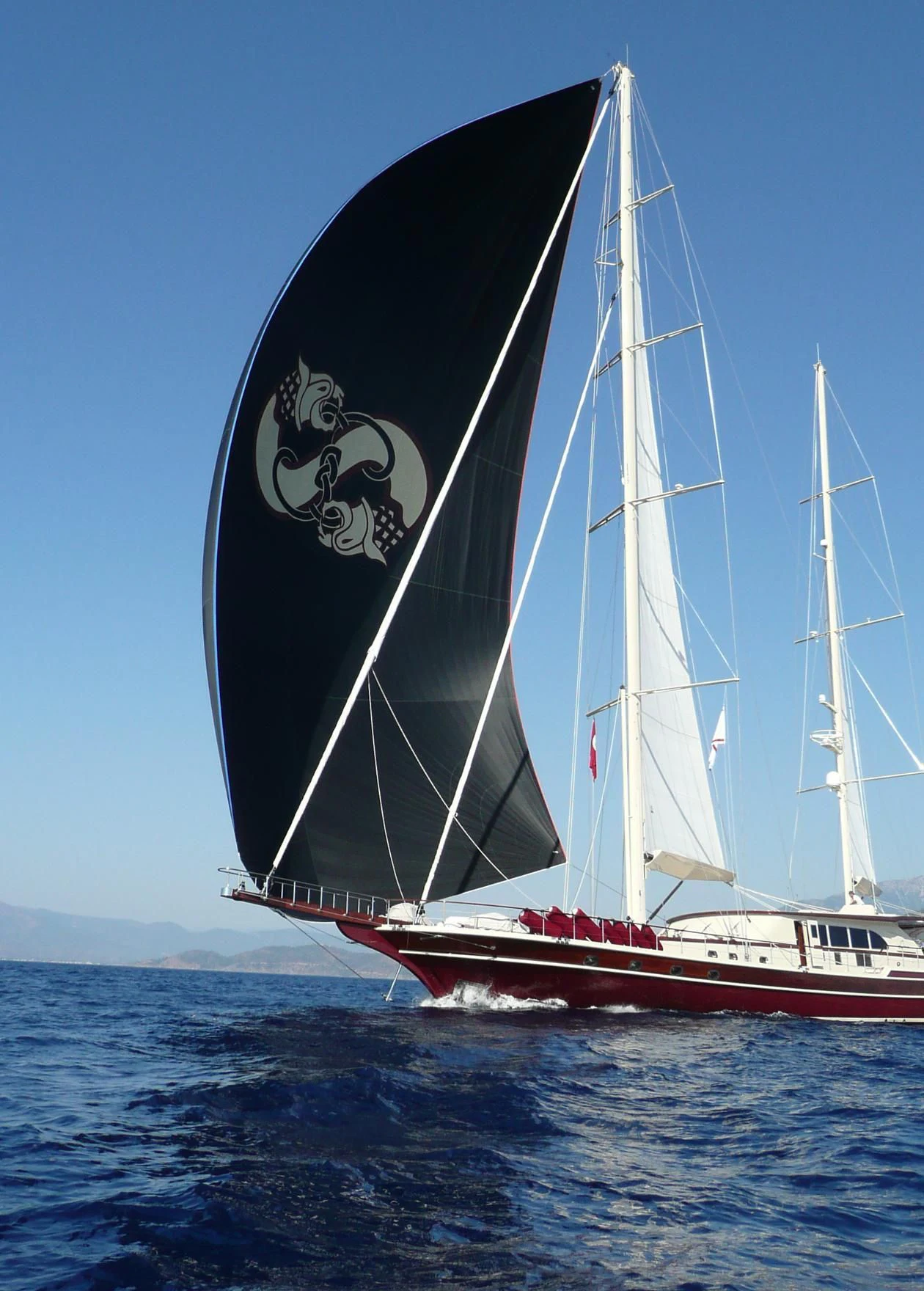 a sailboat on the water aboard DAIMA Yacht for Sale