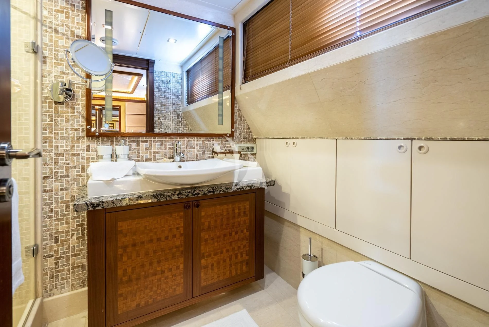 a bathroom with a sink and a toilet aboard DAIMA Yacht for Sale