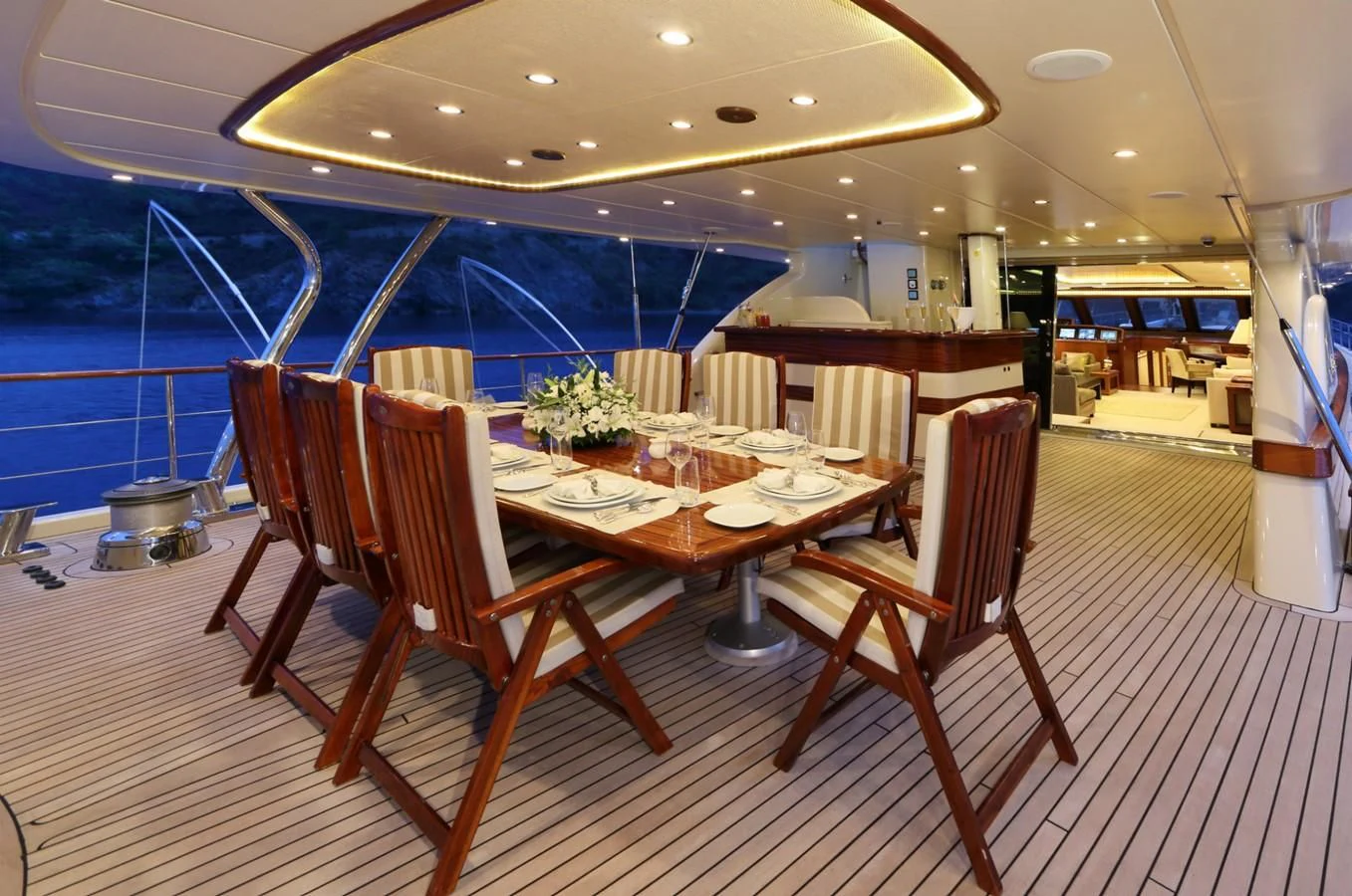 a room with a table and chairs aboard DAIMA Yacht for Sale