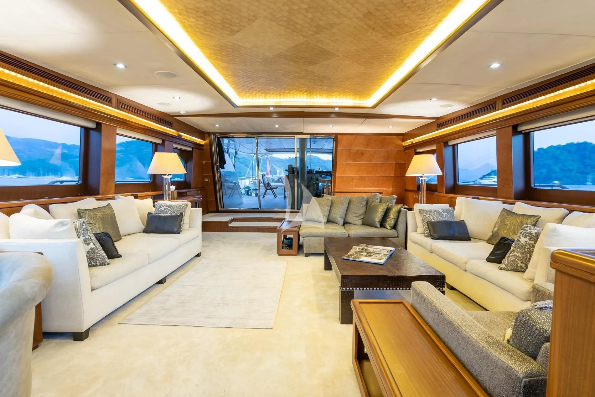 a living room with a large window aboard DAIMA Yacht for Sale