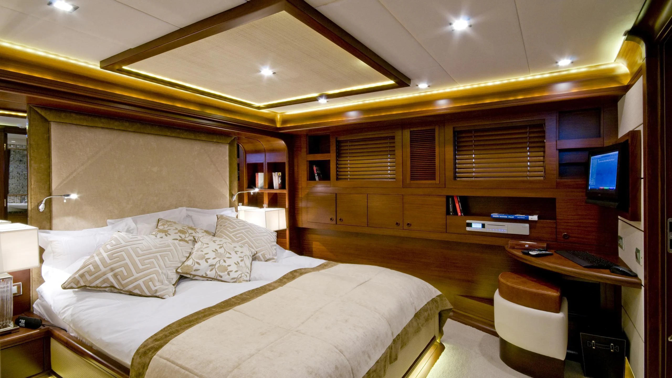 a room with a bed and a tv aboard DAIMA Yacht for Sale
