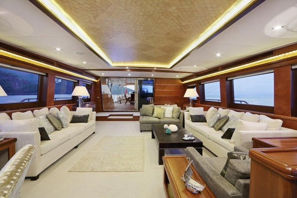 a living room with a large window aboard DAIMA Yacht for Sale