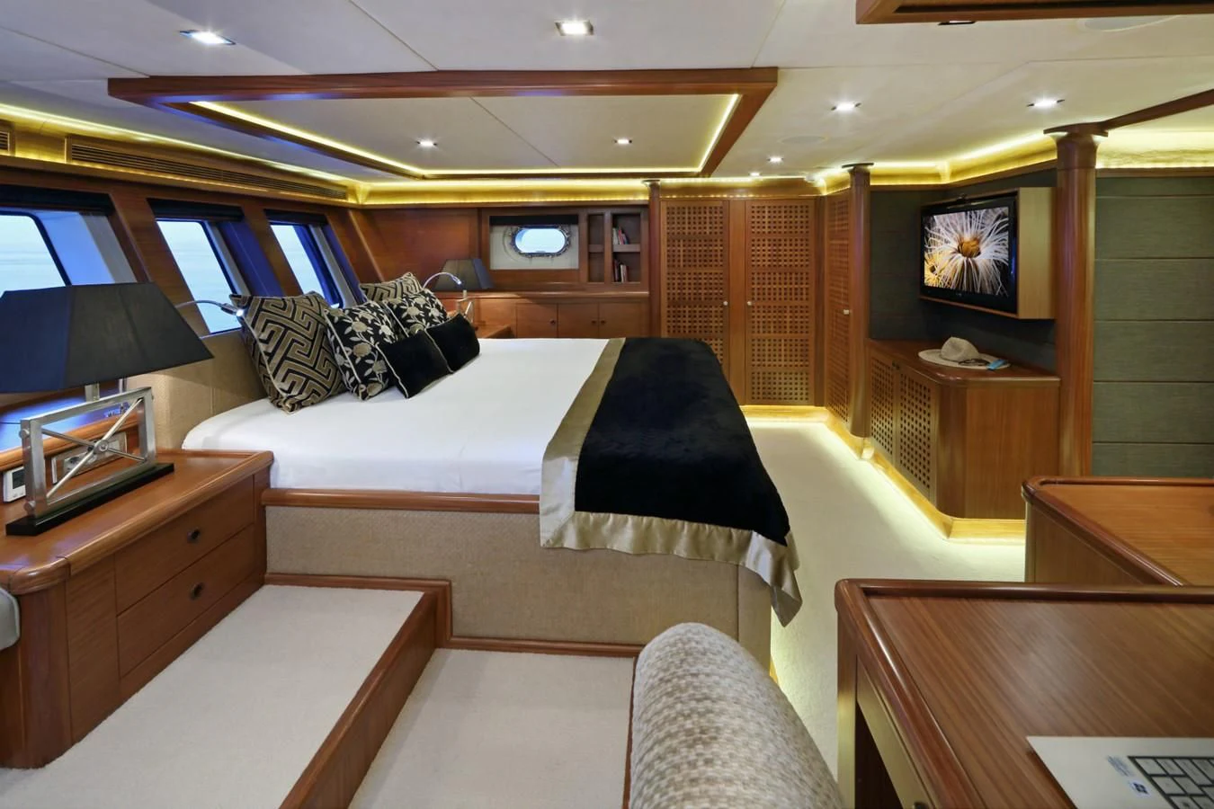 a room with a bed and a tv aboard DAIMA Yacht for Sale