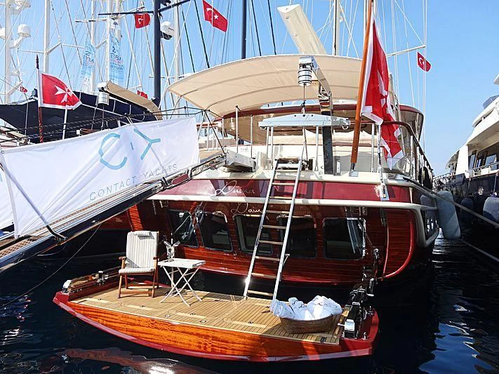 a boat docked at a pier aboard DAIMA Yacht for Sale