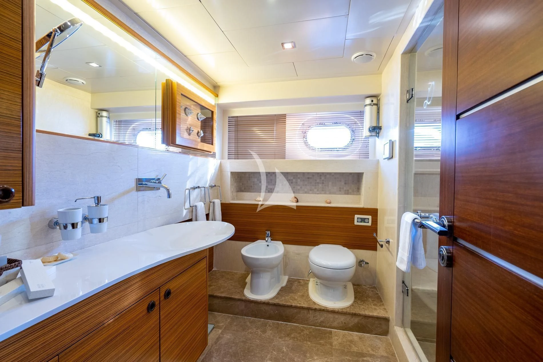 a bathroom with a toilet and a sink aboard DAIMA Yacht for Sale