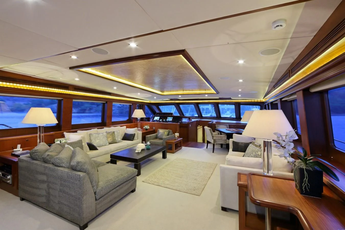 a living room with a large screen aboard DAIMA Yacht for Sale