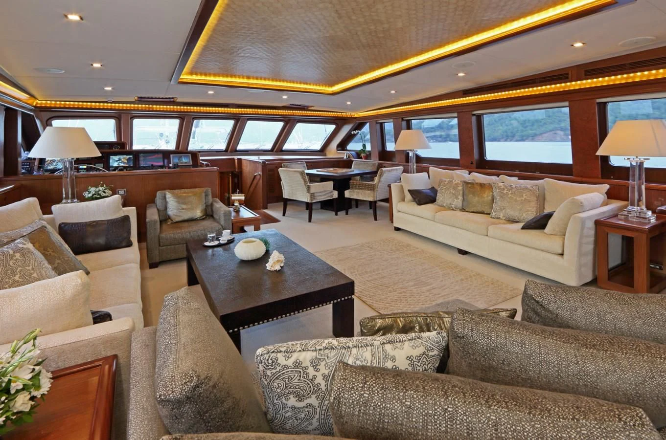 a living room with a large window aboard DAIMA Yacht for Sale