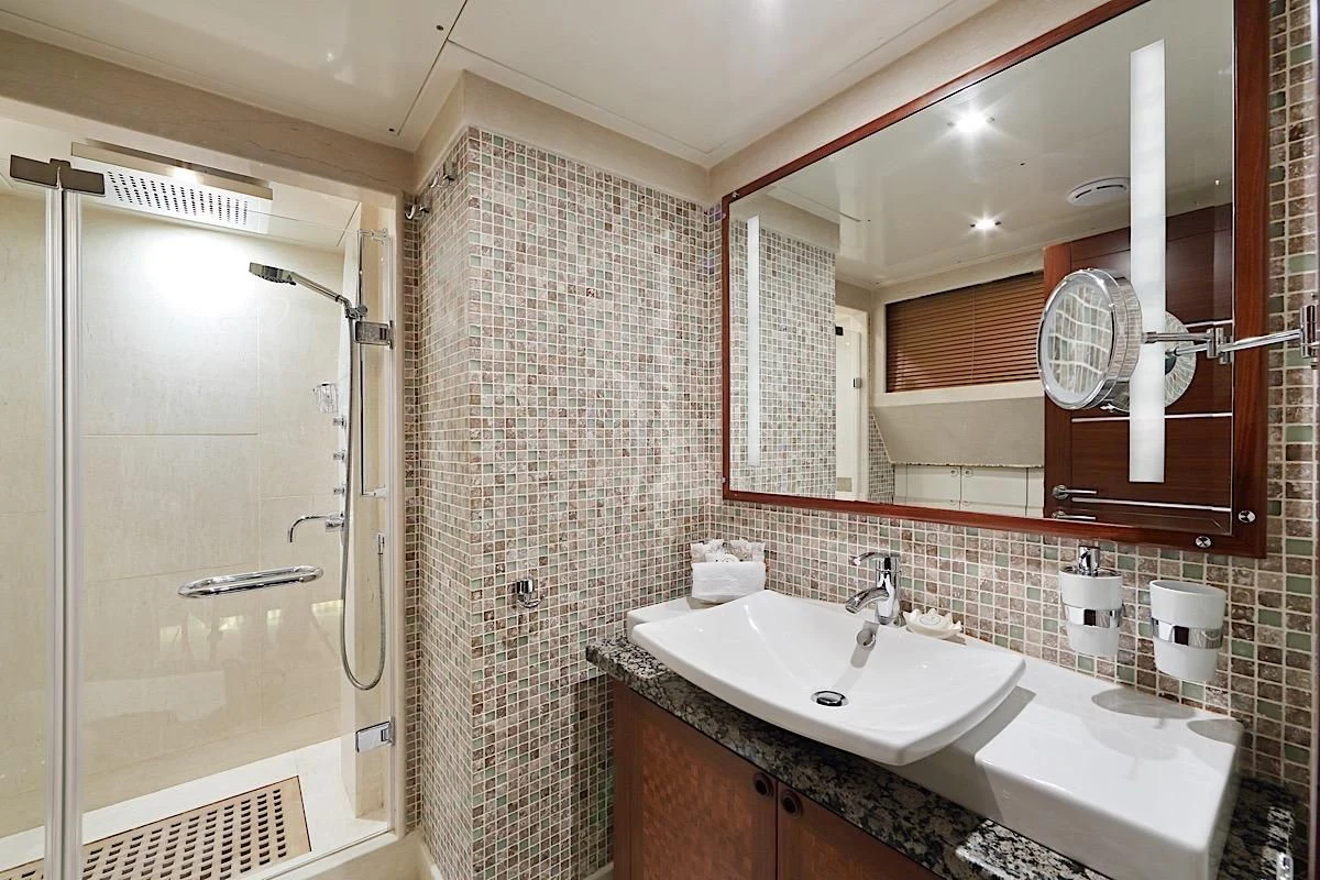 a bathroom with a sink and a shower aboard DAIMA Yacht for Sale