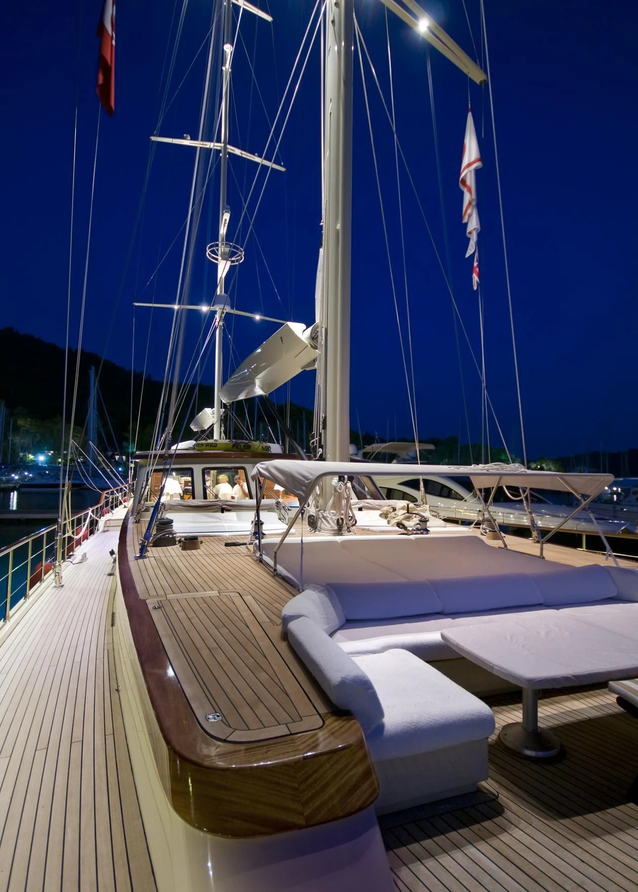a boat with flags on the deck aboard DAIMA Yacht for Sale