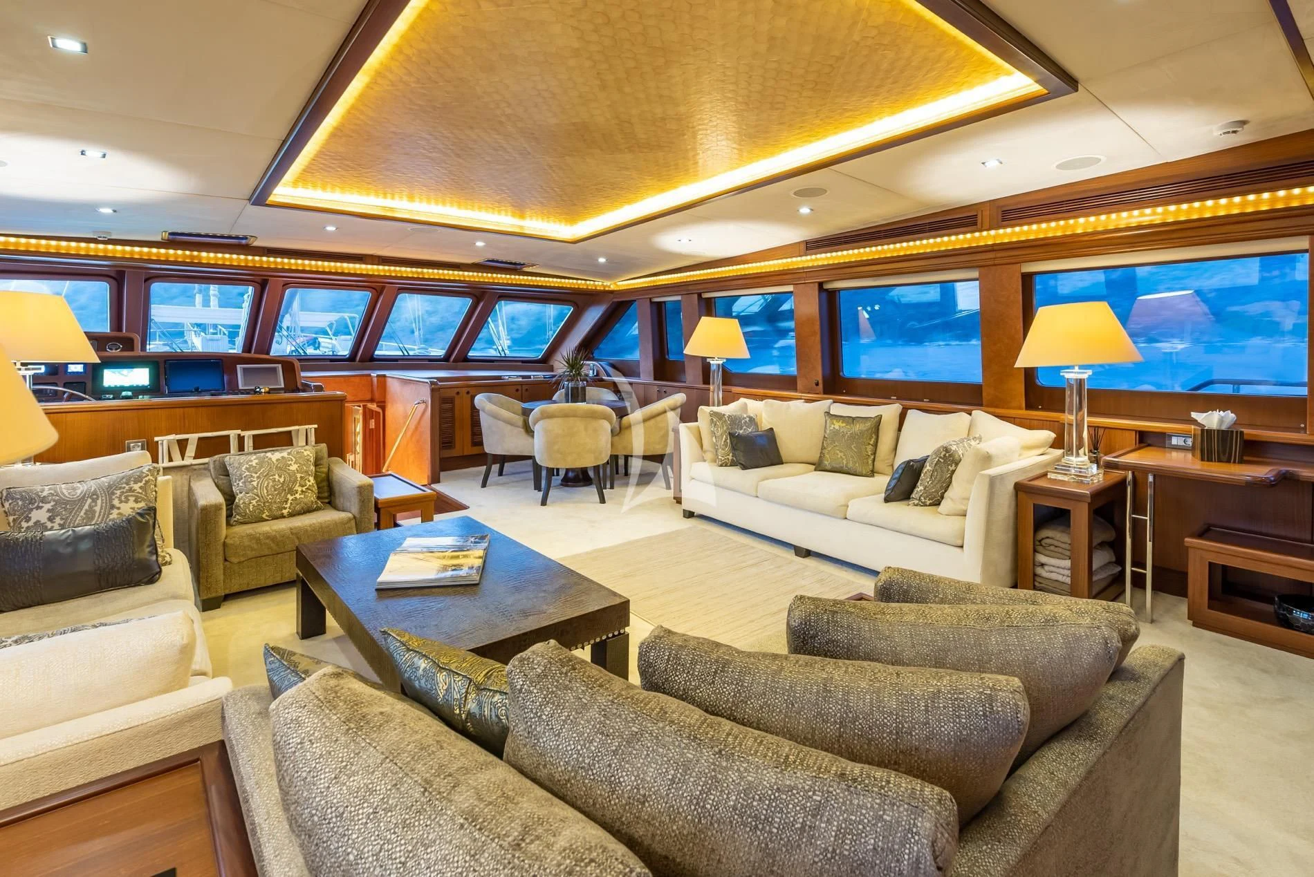 a living room with a large screen aboard DAIMA Yacht for Sale