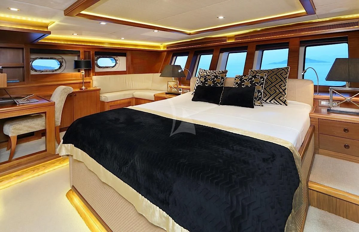 a bed in a room aboard DAIMA Yacht for Sale
