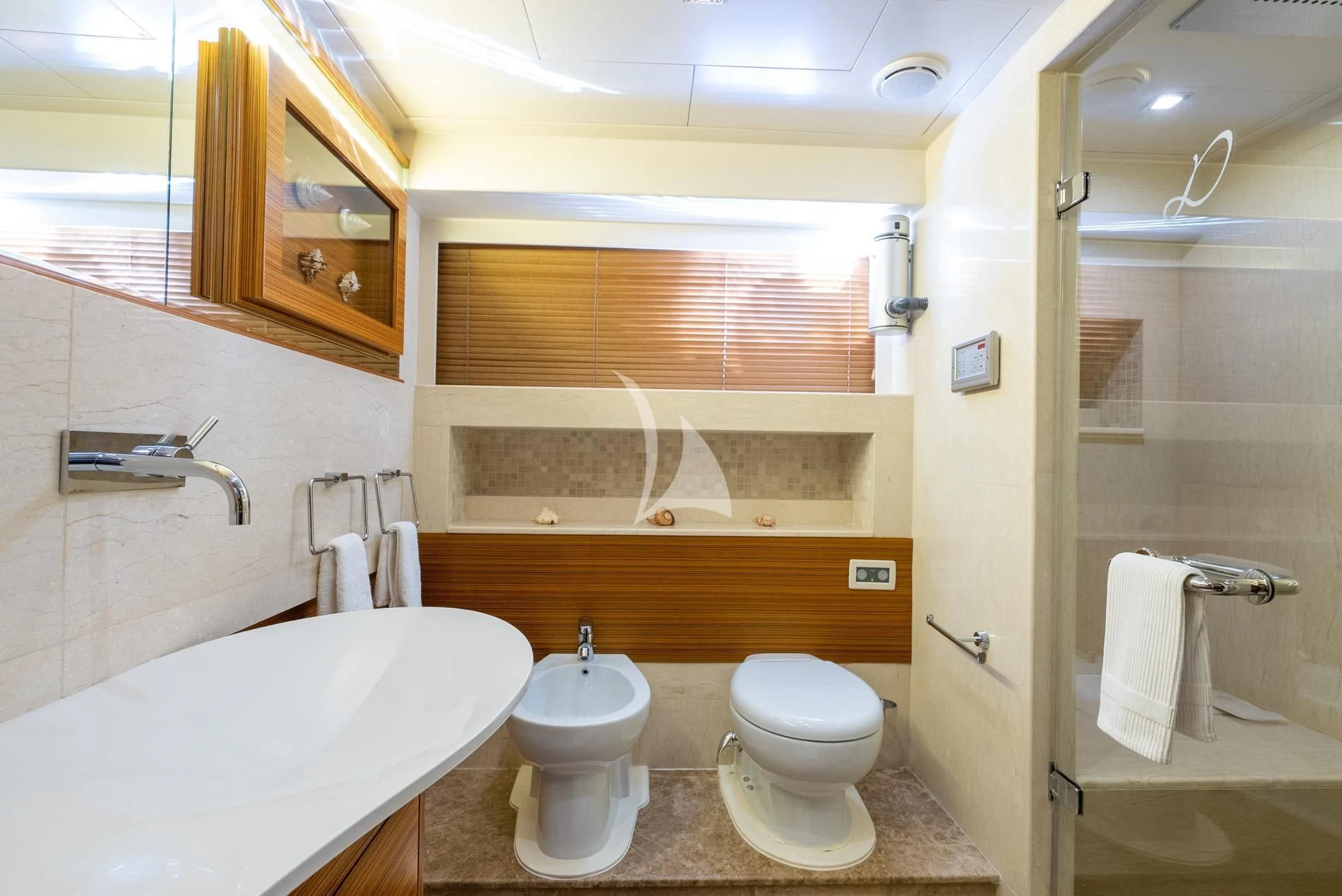 a bathroom with a sink toilet and a bathtub aboard DAIMA Yacht for Sale