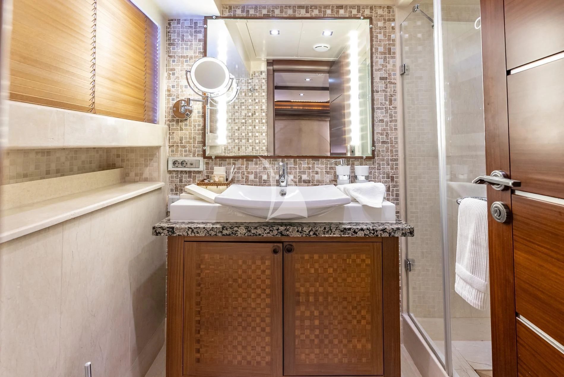 a bathroom with a sink and a mirror aboard DAIMA Yacht for Sale